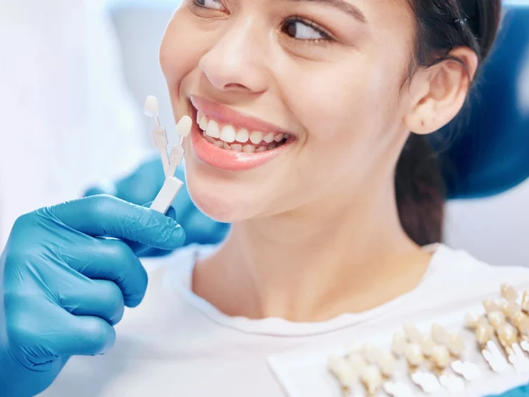 Dentist explaining whether a patient needs a dental crown or filling